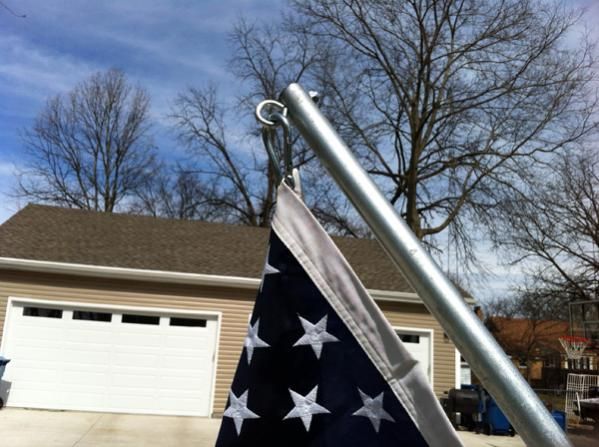 Flag pole is 1" conduit and I put two eyes through bolted secured with nylock bolts, used clips