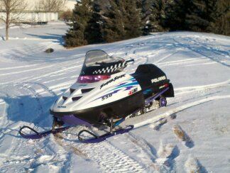 WINTER FUN!!!!       99 super sport with 192 studs in track great hole shot sled.  wifes ride.