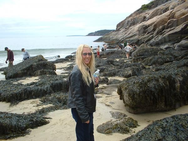 Shelly, grossed out a little by the seaweedy/mossy stuff on the rocks.