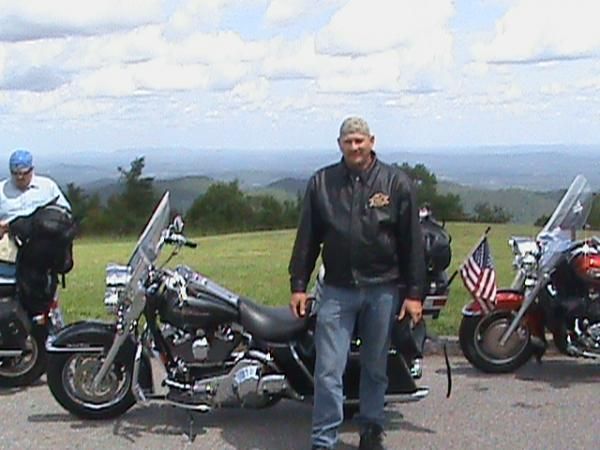 JD Holbrooks and his 2004 Harley Road King. His liscense plate says  MI HOGG .