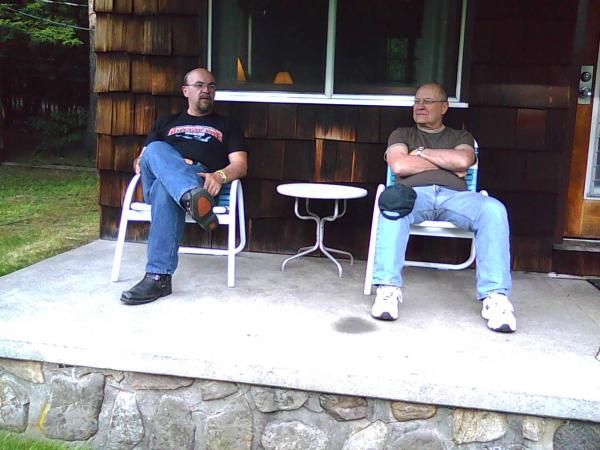 My brother Alain and i relaxing in front of his room at Carey's lakeside cottages at Americade 2009