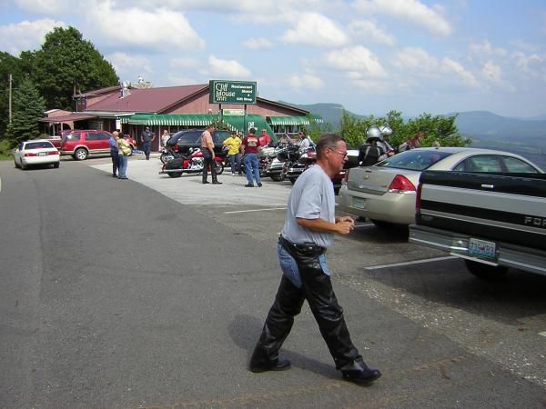 Ponch walking by Cliff House Restaurant parking lot.