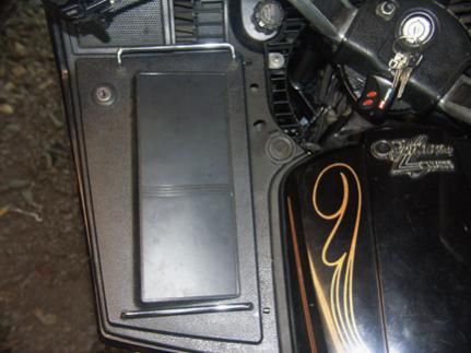 console cover is OEM item used to cover stock radio electrical plugs when radio is pulled from bike.