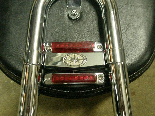 The top light is mounted through the metal plate for the backrest.  I tapped the holes and used the 