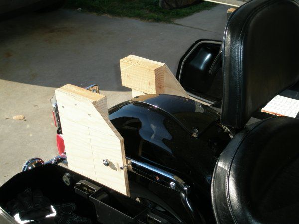 I drilled a hole through the plywood aligned to the hole where the pegs for the passenger backrest m
